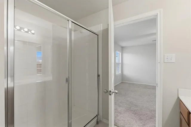 a bathroom with a sink and mirror