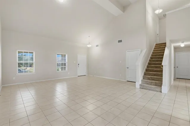 a view of an empty room with white walls