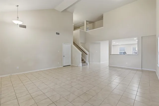 a large kitchen with stainless steel appliances granite countertop a sink and cabinets