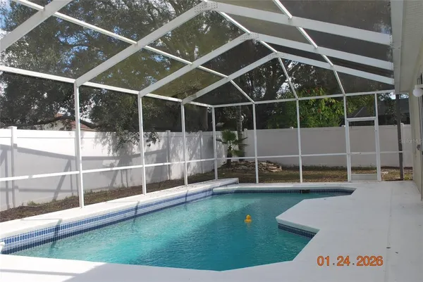 a view of a swimming pool with a porch