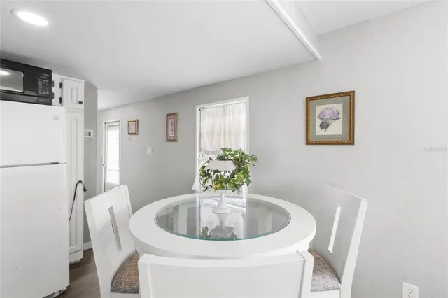 a white bath tub sitting next to a white toilet