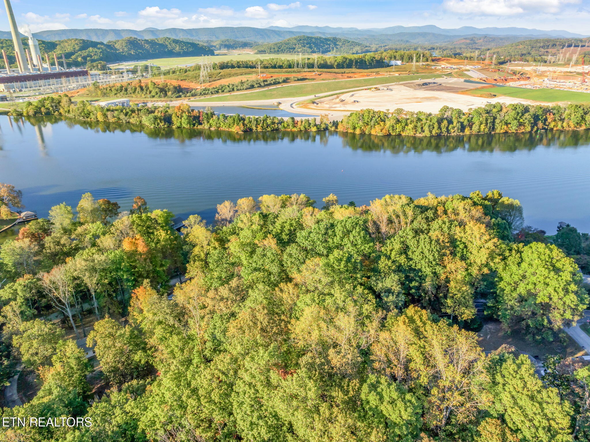 0 Lakewood Road Kingston, TN 37763 - Photo 14 of 22 a view of a lake with a houses in the background