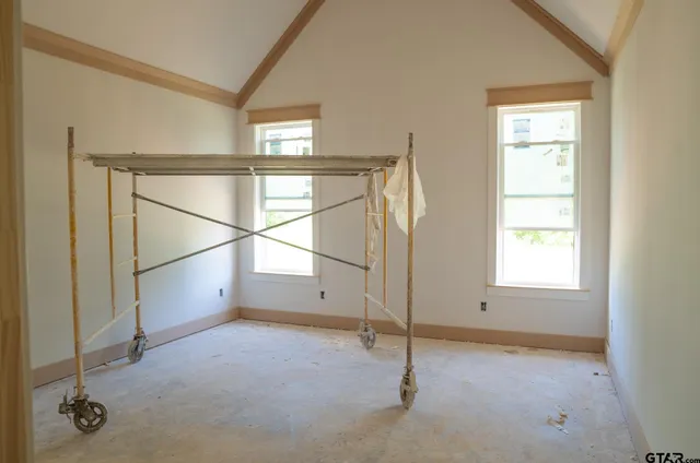 an empty room with windows