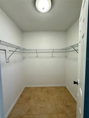 a view of a room with racks on the wall