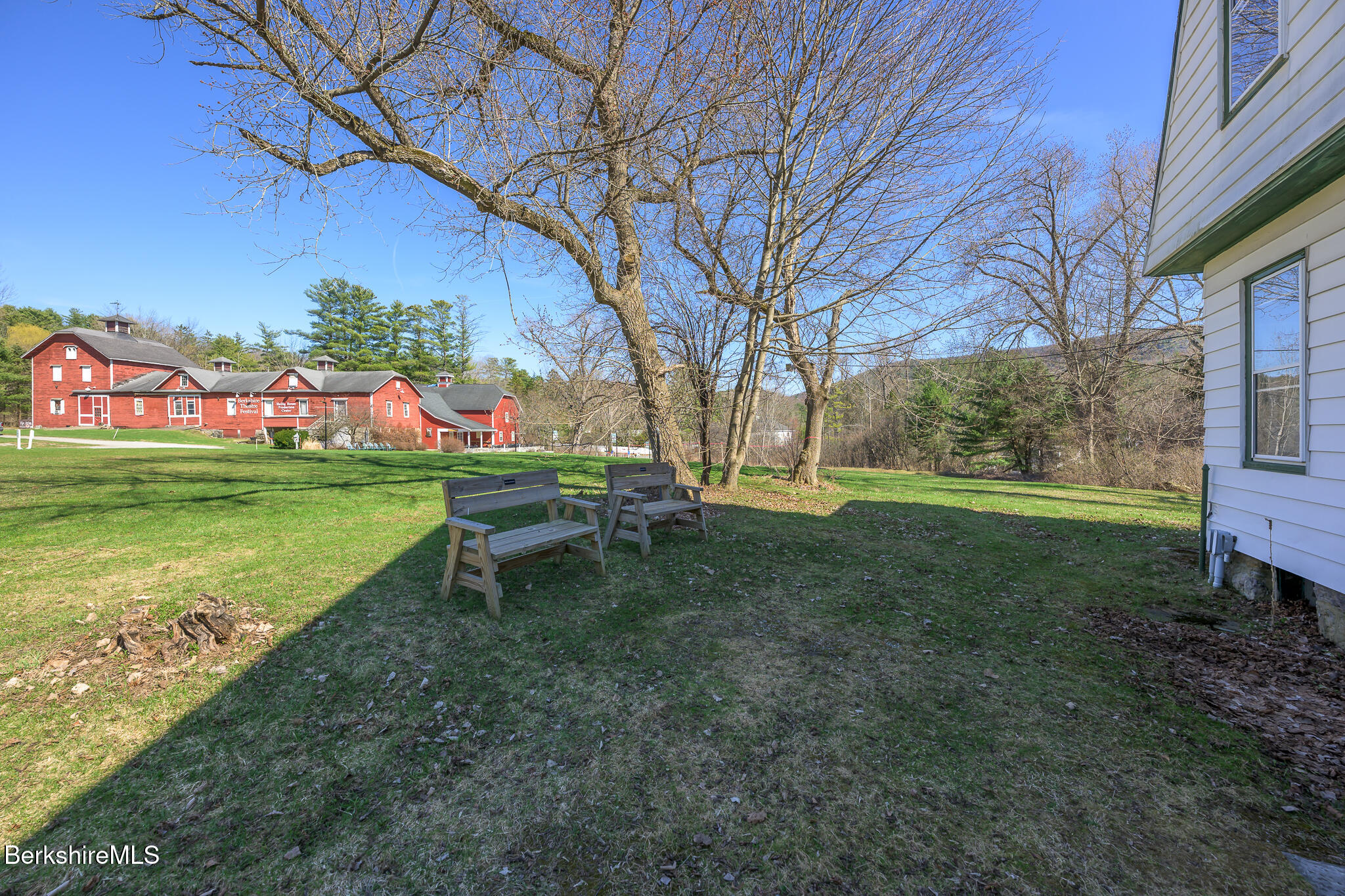 6 East Street Stockbridge, MA 01262 - Photo 22 of 23 a backyard of a house with table and chairs