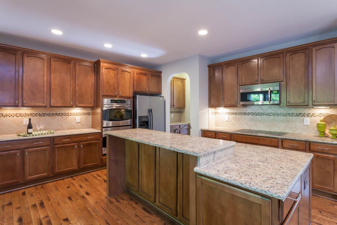 8915 Scotch Castle Drive Raleigh, NC 27612 - Photo 6 of 25 The kitchen is a cook's delight and offers GE Profile double ovens and dishwasher. There is also an Advantium Microwave/Convection Oven. Kitchen