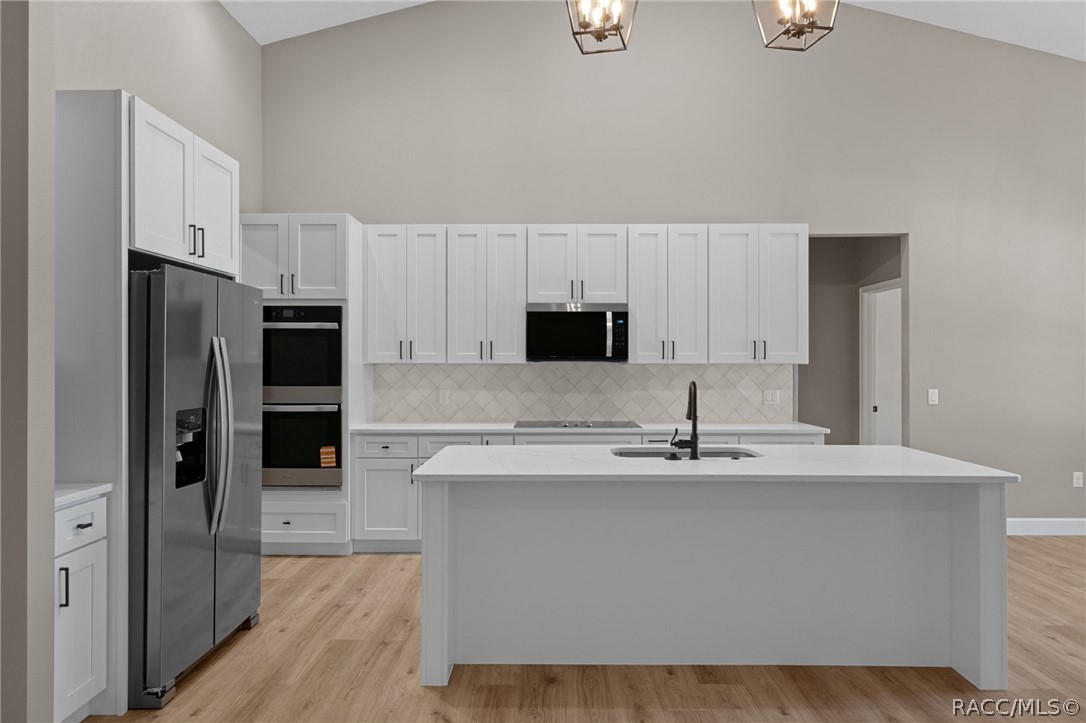 4530 South Florida Avenue Inverness, FL 34450 - Photo 10 of 100 a kitchen with kitchen island granite countertop a sink stainless steel appliances and cabinets