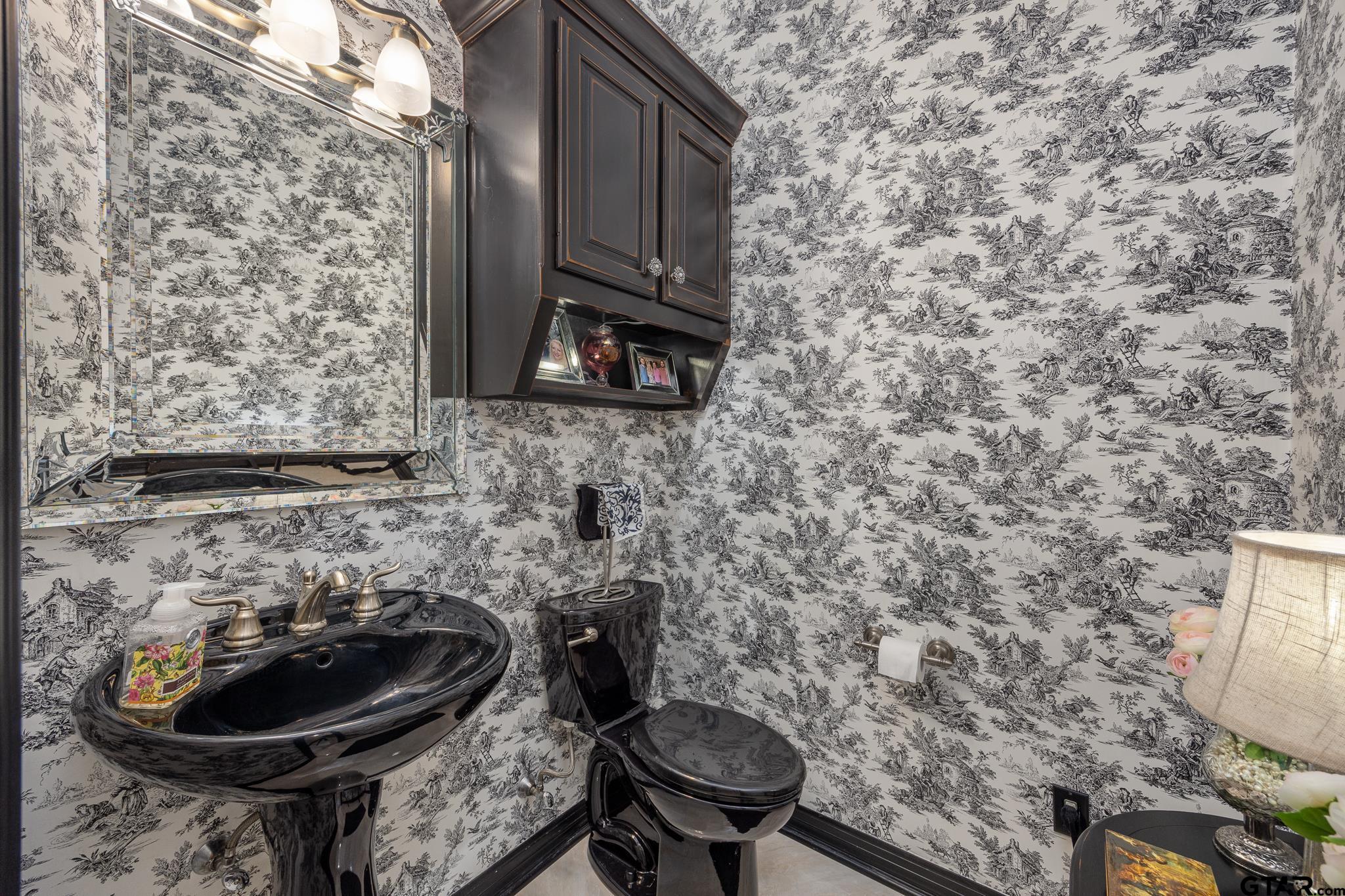 5875 Stonegate Trail Tyler, TX 75703 - Photo 12 of 47 a bathroom with a toilet and a sink