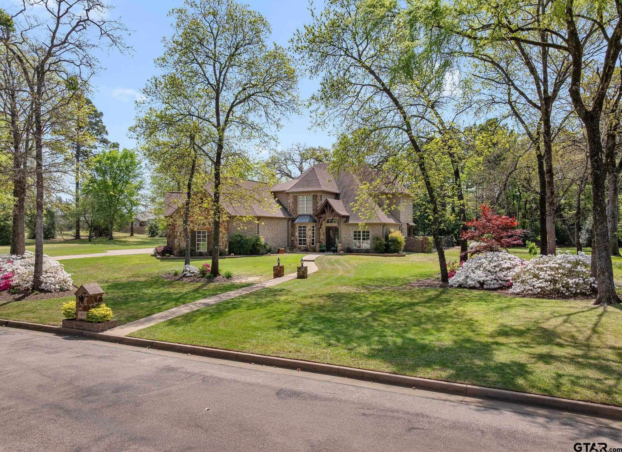 5875 Stonegate Trail Tyler, TX 75703 - Photo 2 of 47 a view of a park with large trees