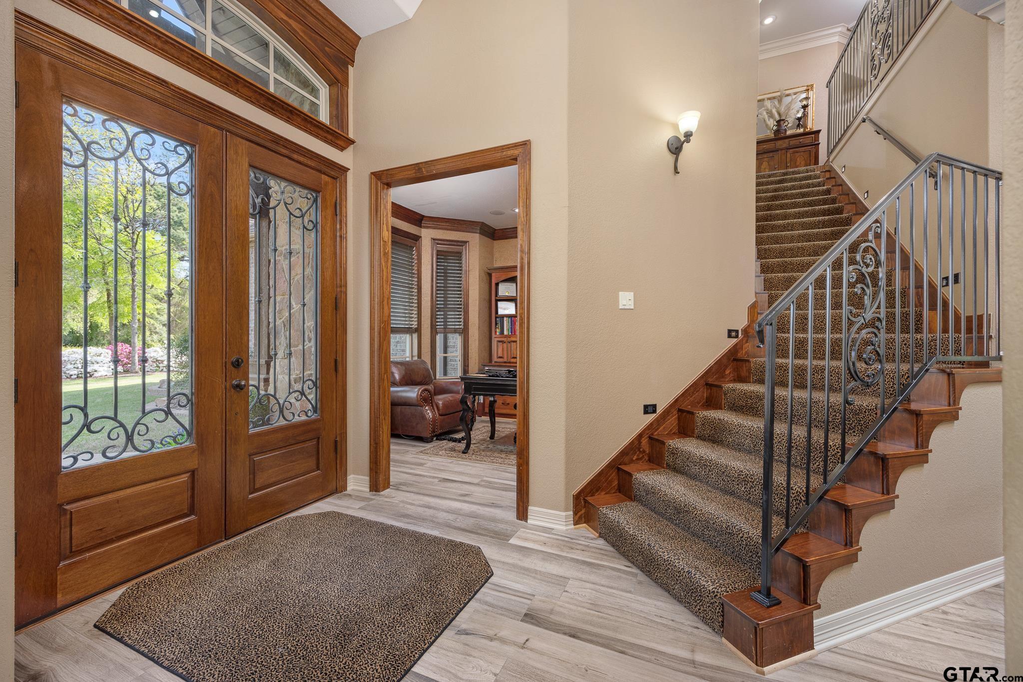 5875 Stonegate Trail Tyler, TX 75703 - Photo 21 of 47 a view of entryway and hall with wooden floor