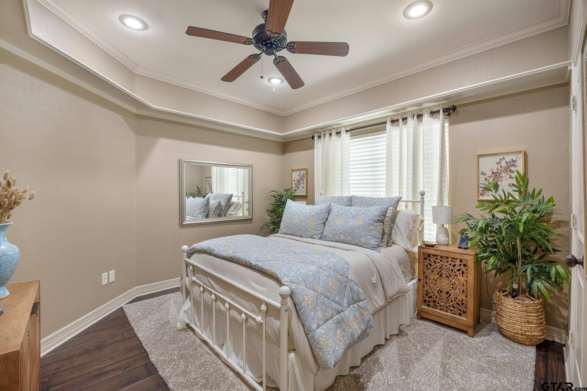 5875 Stonegate Trail Tyler, TX 75703 - Photo 23 of 47 a bedroom with a large bed and a window