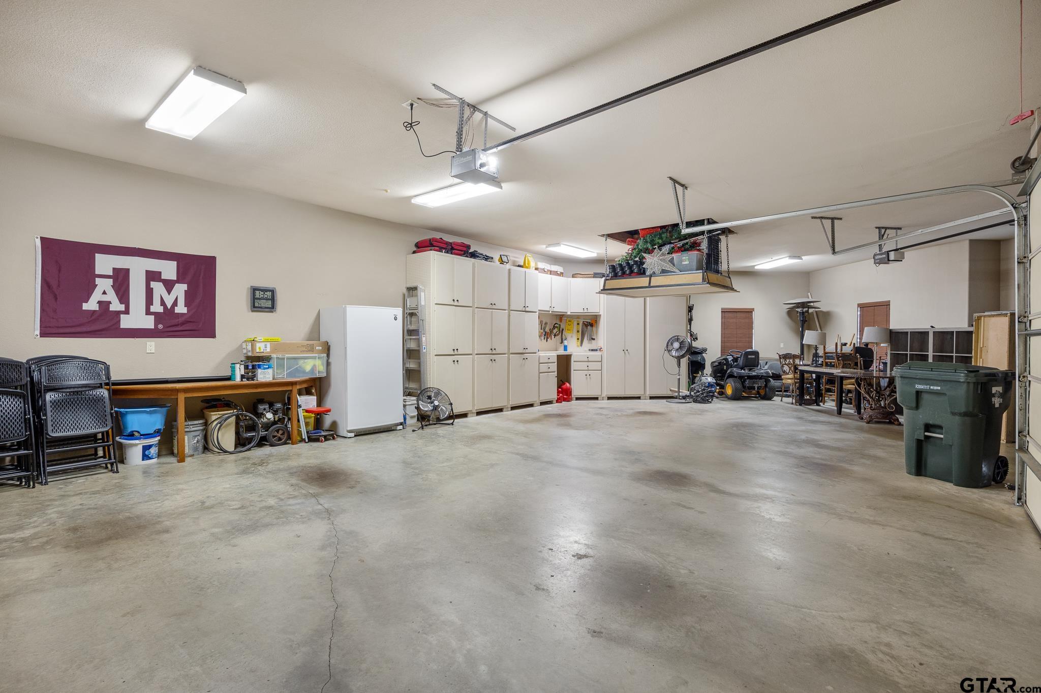 5875 Stonegate Trail Tyler, TX 75703 - Photo 43 of 47 a view of a garage with gym equipment