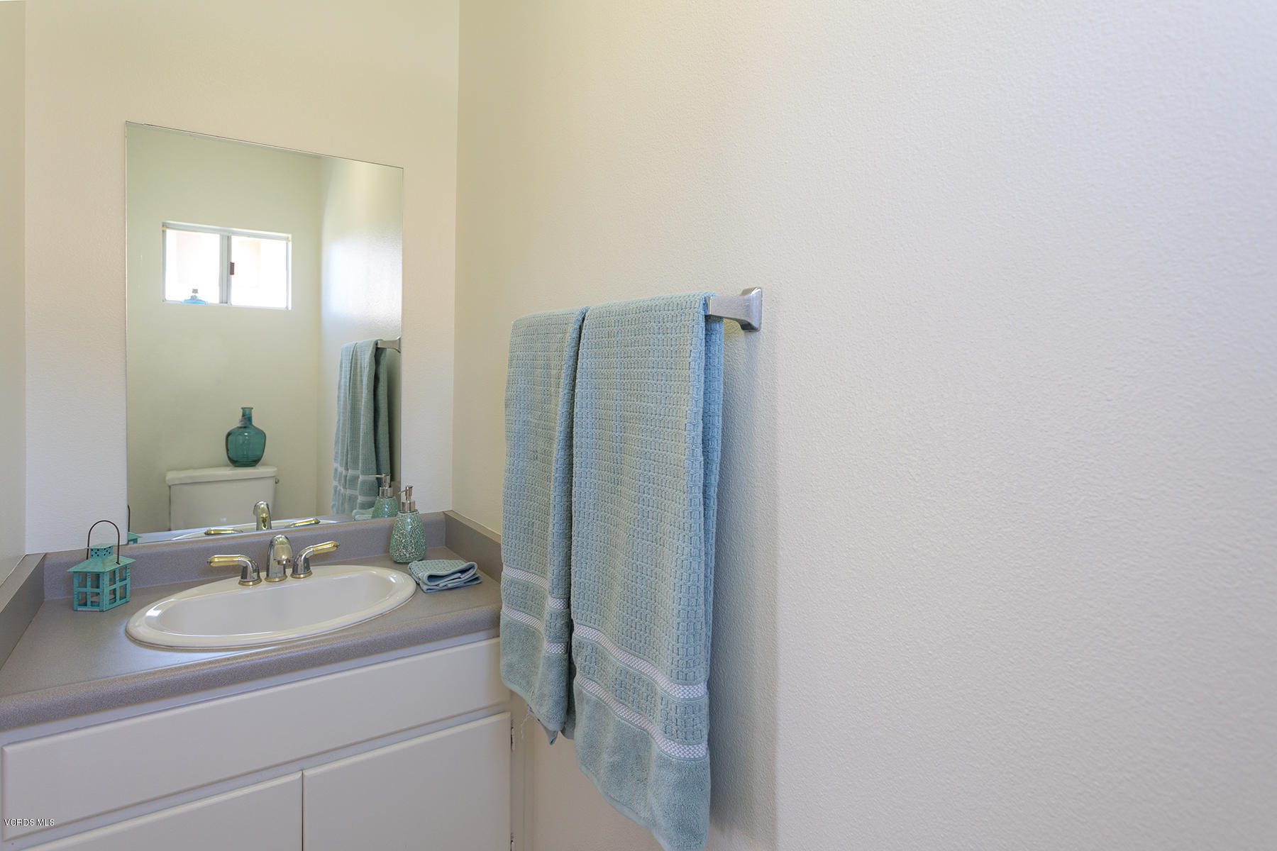 4516 Apricot Road, Unit B Simi Valley, CA 93063 - Photo 8 of 24 a bathroom with a sink and a mirror