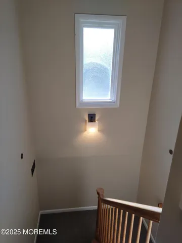 a hallway with a wooden closet