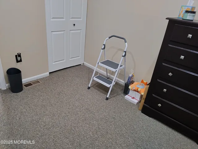a bathroom with a toilet a sink and a mirror