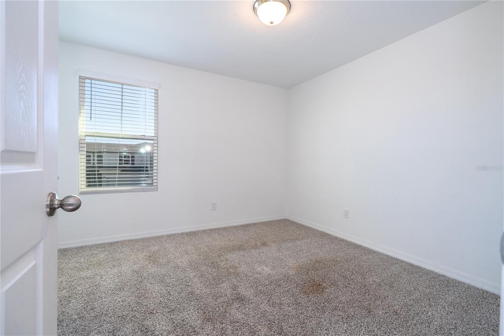 4549 Burrowing Owl Loop St. Cloud, FL 34772 - Photo 35 of 77 an empty room with a window