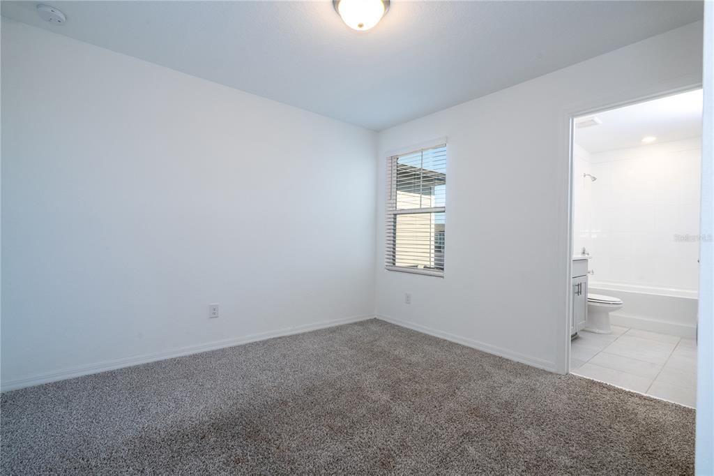 4549 Burrowing Owl Loop St. Cloud, FL 34772 - Photo 42 of 77 an empty room with a window