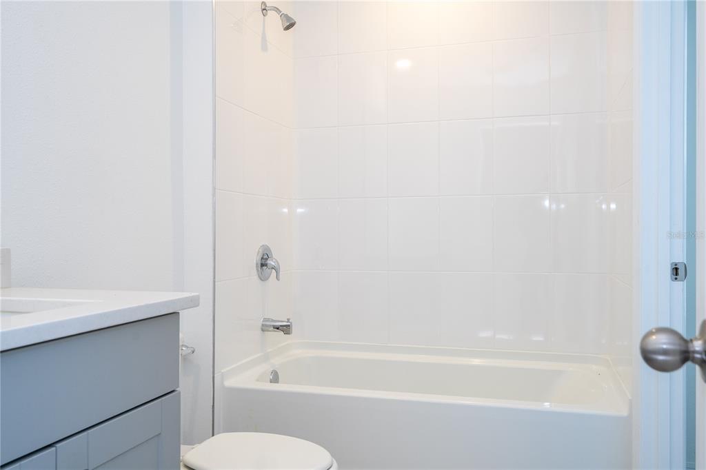 4549 Burrowing Owl Loop St. Cloud, FL 34772 - Photo 44 of 77 a bathroom with a bathtub