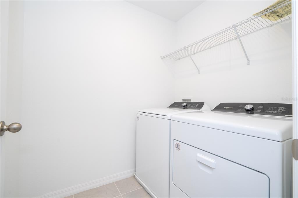 4549 Burrowing Owl Loop St. Cloud, FL 34772 - Photo 46 of 77 a utility room with dryer and washer
