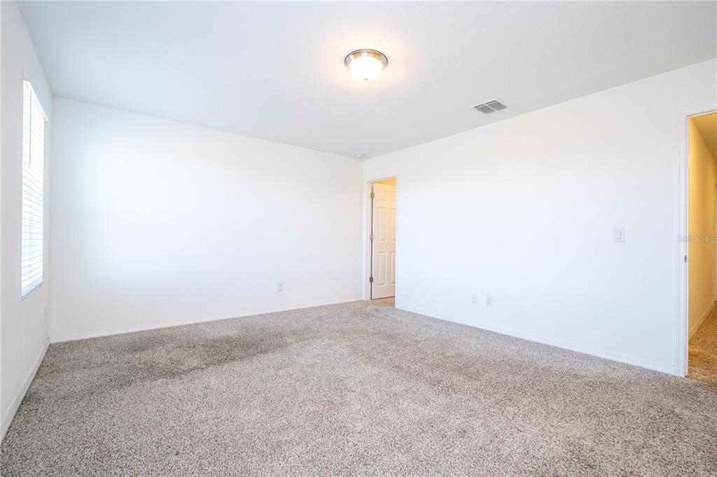 4549 Burrowing Owl Loop St. Cloud, FL 34772 - Photo 49 of 77 a view of an empty room