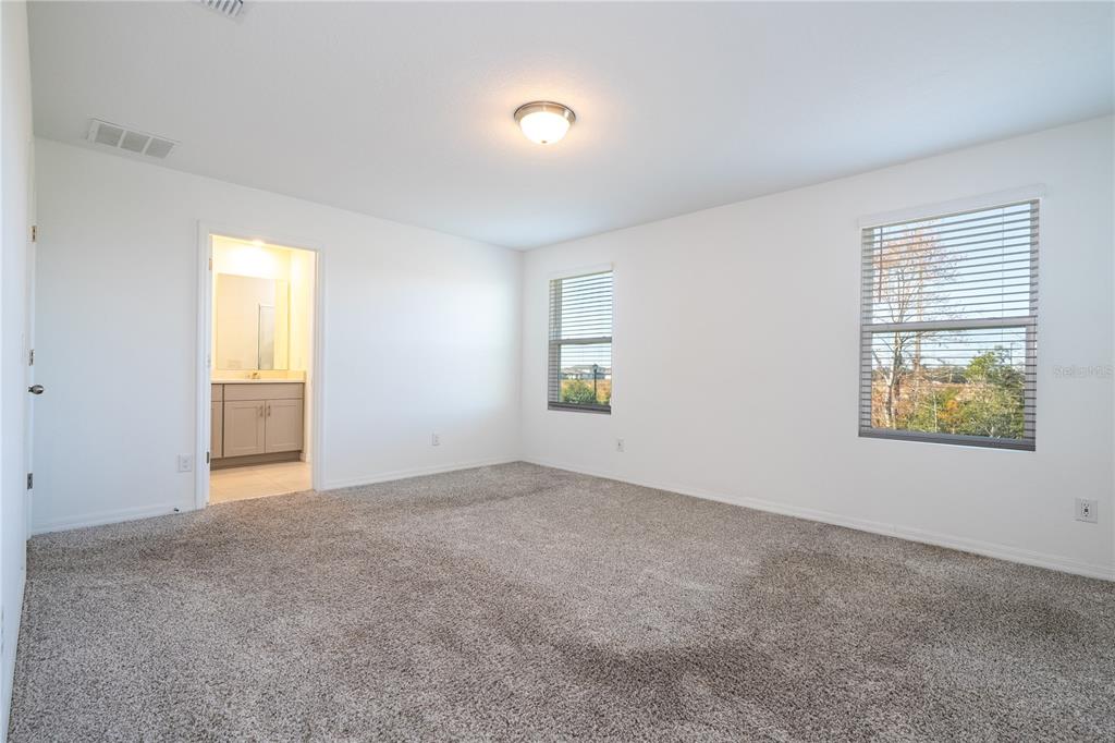 4549 Burrowing Owl Loop St. Cloud, FL 34772 - Photo 52 of 77 an empty room with windows