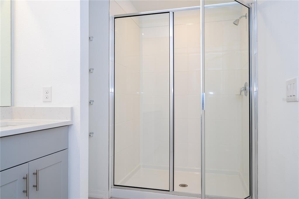 4549 Burrowing Owl Loop St. Cloud, FL 34772 - Photo 54 of 77 a bathroom with a shower