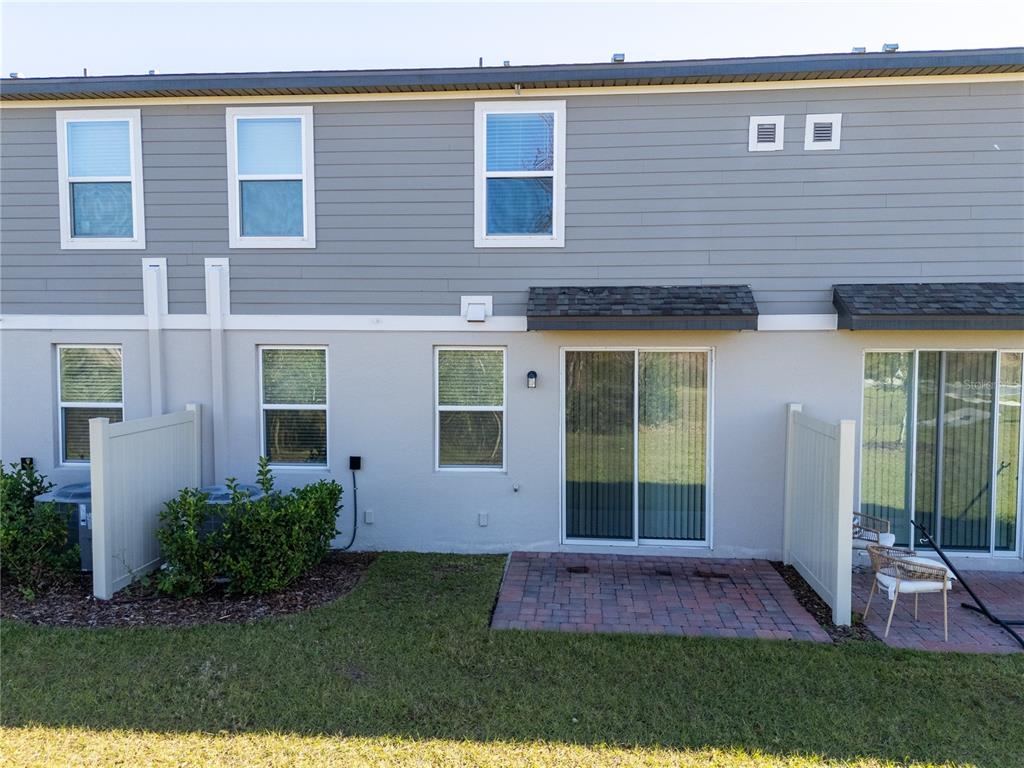 4549 Burrowing Owl Loop St. Cloud, FL 34772 - Photo 59 of 77 a view of outdoor space yard and front view of a house