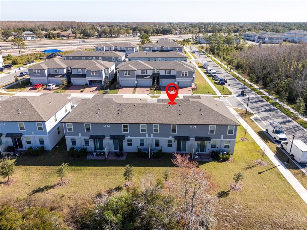 4549 Burrowing Owl Loop St. Cloud, FL 34772 - Photo 61 of 77 a aerial view of a house with a lake view