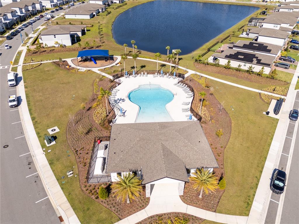 4549 Burrowing Owl Loop St. Cloud, FL 34772 - Photo 72 of 77 an aerial view of a swimming pool