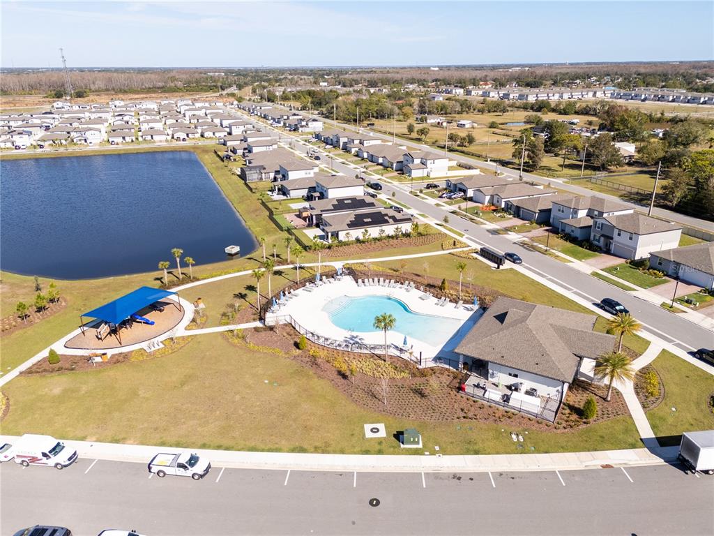 4549 Burrowing Owl Loop St. Cloud, FL 34772 - Photo 77 of 77 an aerial view of residential houses with outdoor space