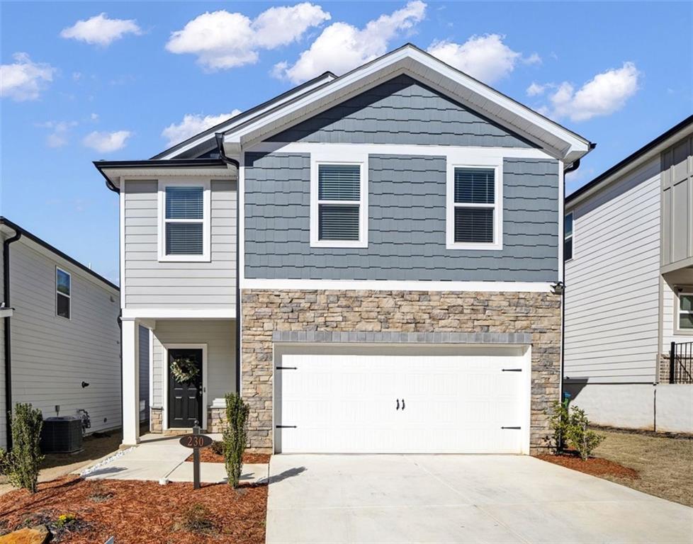 a front view of a house with a garage