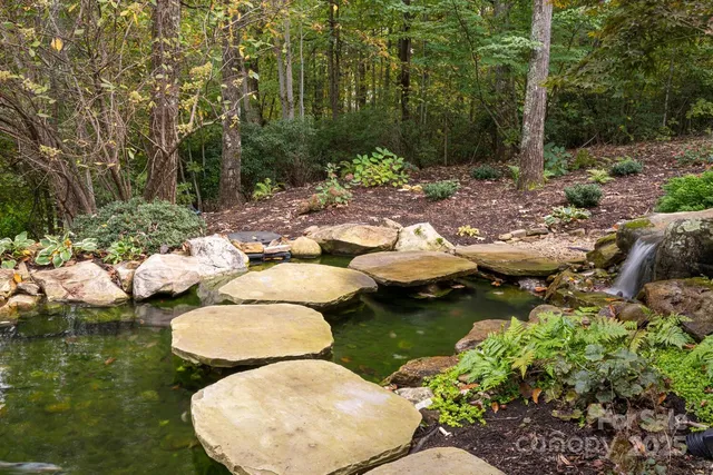 a view of a lake with sitting area