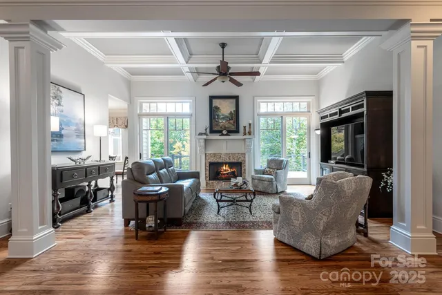 a living room with furniture fireplace and flat screen tv