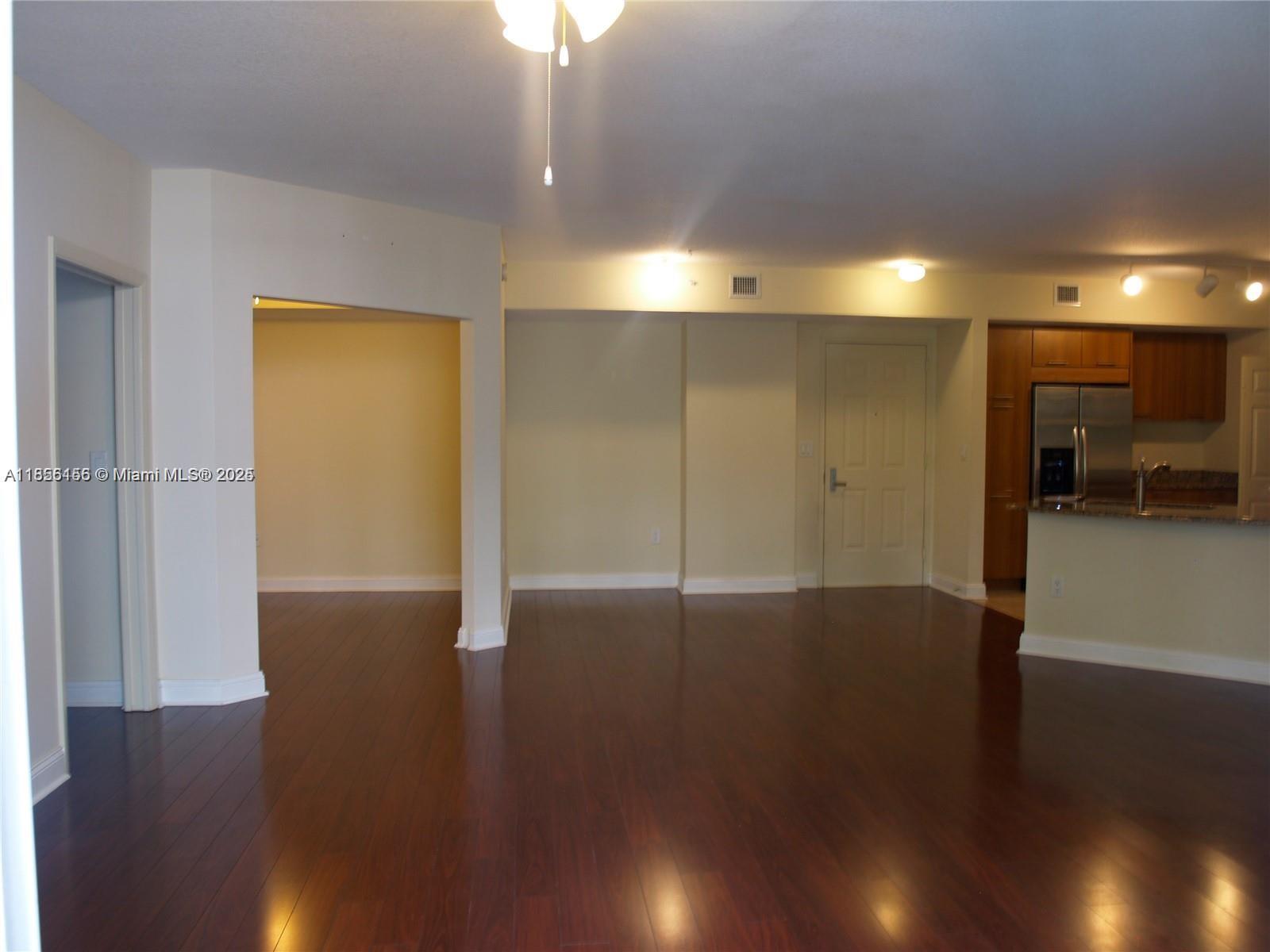510 Northwest 84th Avenue, Unit 324 Plantation, FL 33324 - Photo 20 of 25 a view of a livingroom with wooden floor