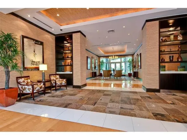 a view of living room filled with furniture and window
