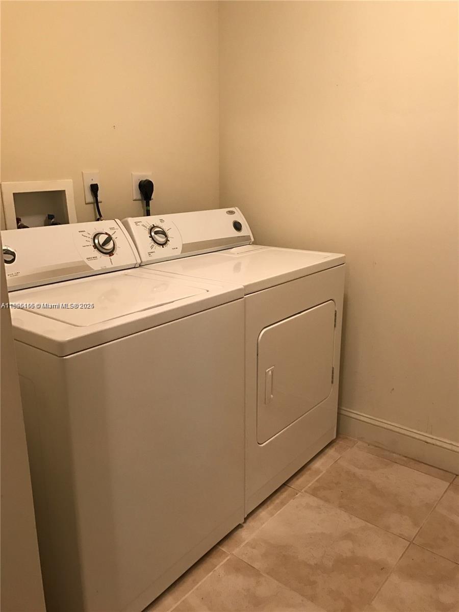 510 Northwest 84th Avenue, Unit 324 Plantation, FL 33324 - Photo 23 of 25 a utility room with dryer and washer