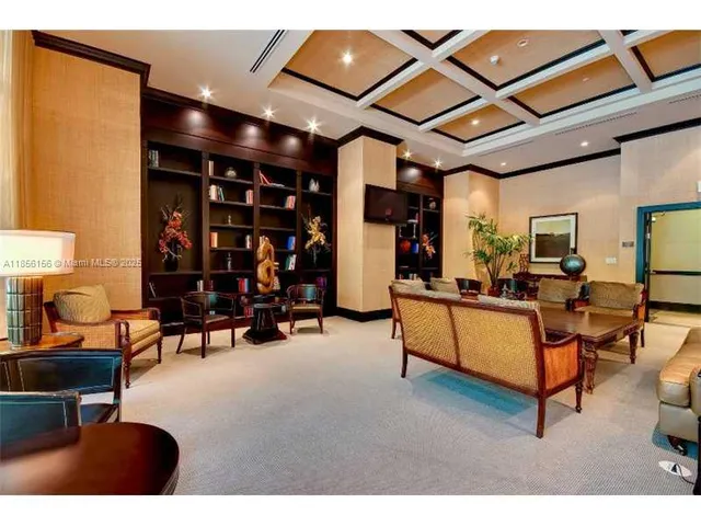 a living room with furniture a table and chairs