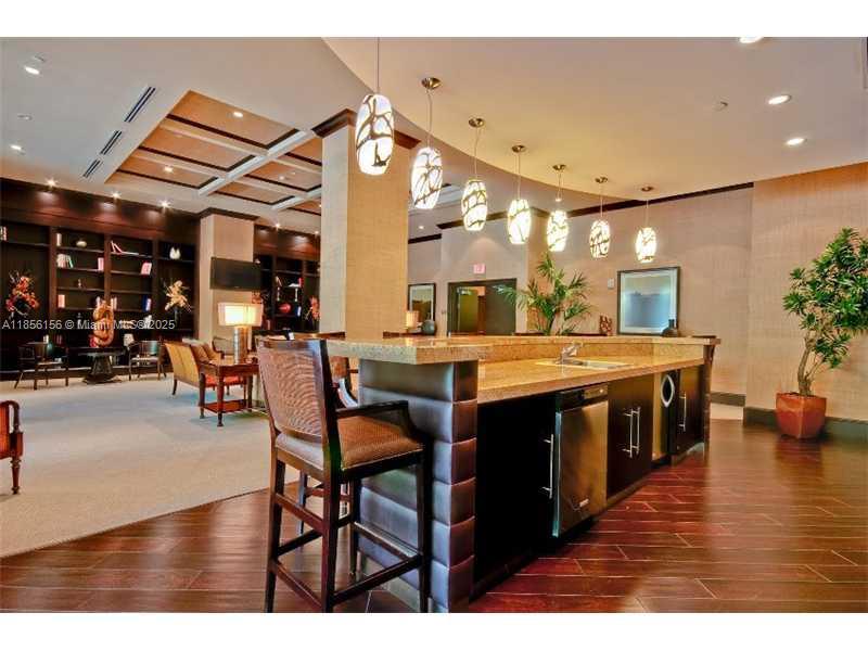 510 Northwest 84th Avenue, Unit 324 Plantation, FL 33324 - Photo 6 of 25 a open kitchen with a table and chairs