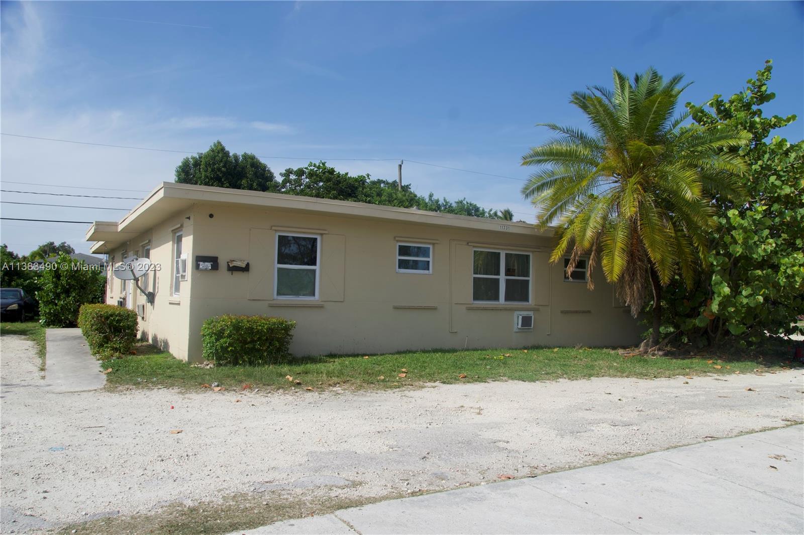 Goulds Miami, FL 33170 - Photo 1 of 10 a front view of a house with a garden