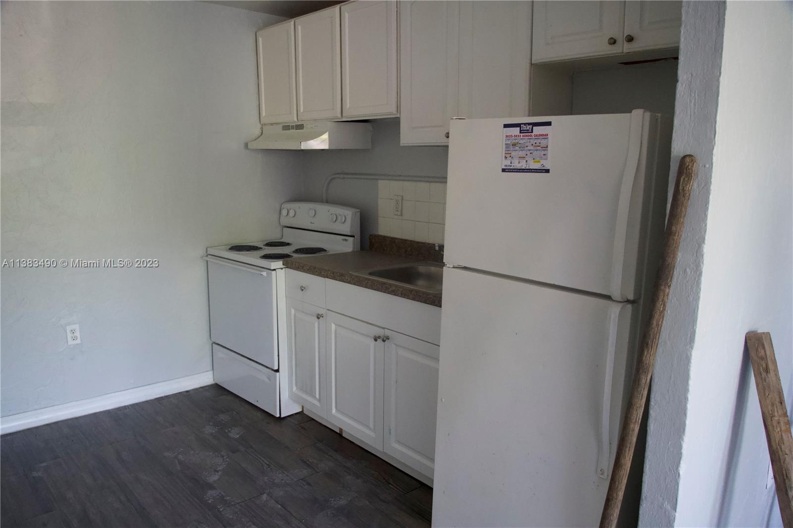 Goulds Miami, FL 33170 - Photo 8 of 10 a white refrigerator freezer sitting inside of a kitchen