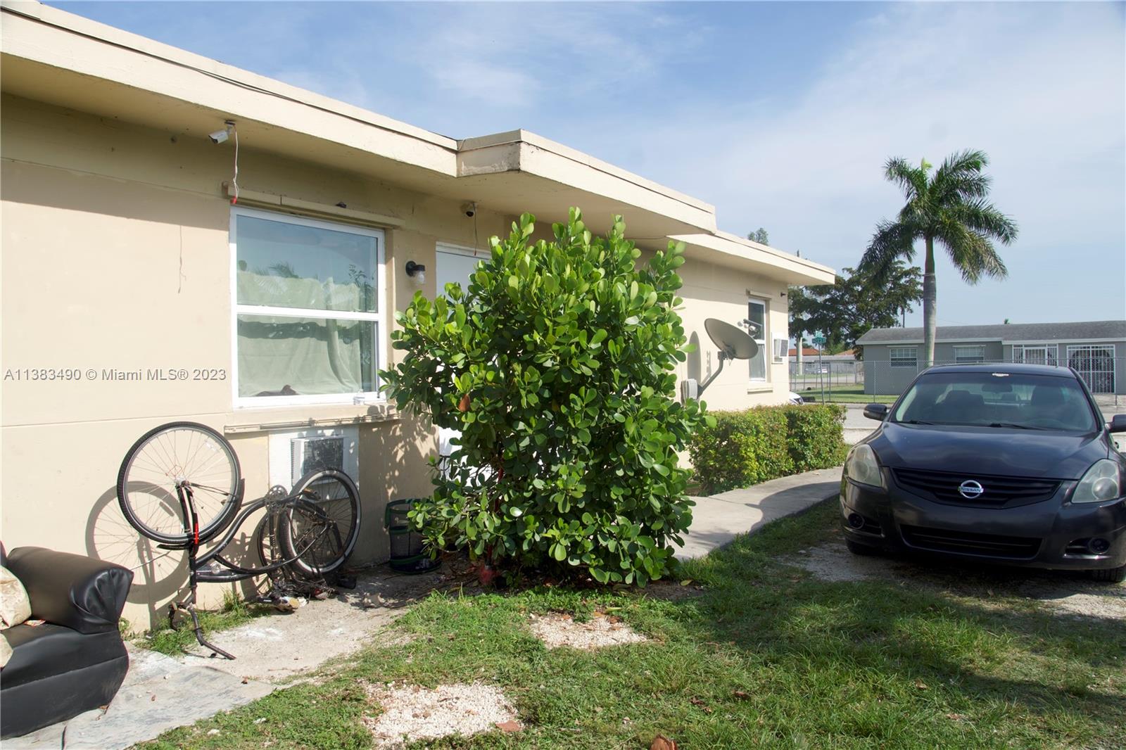 Goulds Miami, FL 33170 - Photo 10 of 10 a front view of a house with garden