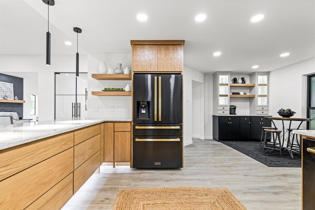 1112 Chesterton Drive Richardson, TX 75080 - Photo 13 of 31 a kitchen with stainless steel appliances granite countertop a refrigerator and a sink