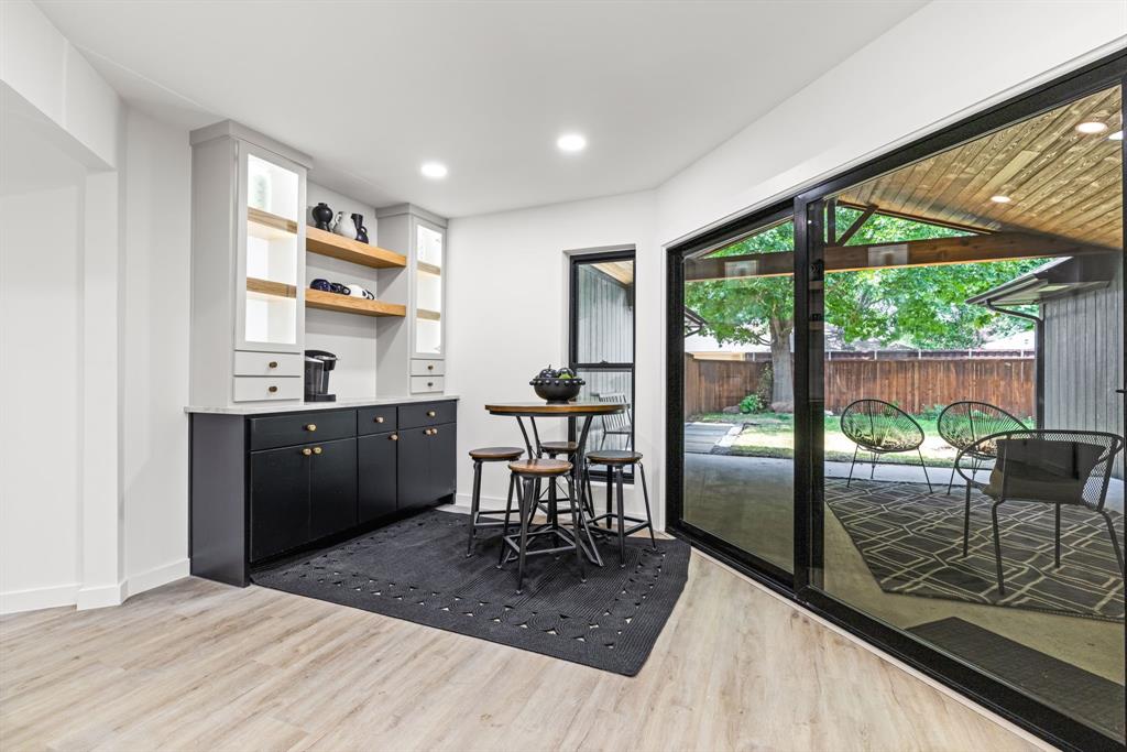 1112 Chesterton Drive Richardson, TX 75080 - Photo 15 of 31 a room with furniture and a floor to ceiling window