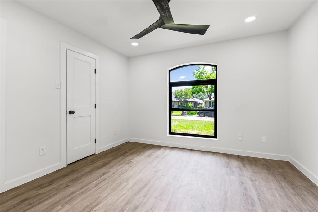 1112 Chesterton Drive Richardson, TX 75080 - Photo 21 of 31 wooden floor in an empty room with a window