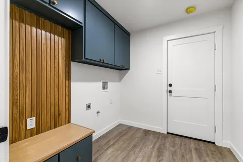a view of a kitchen with wooden floor
