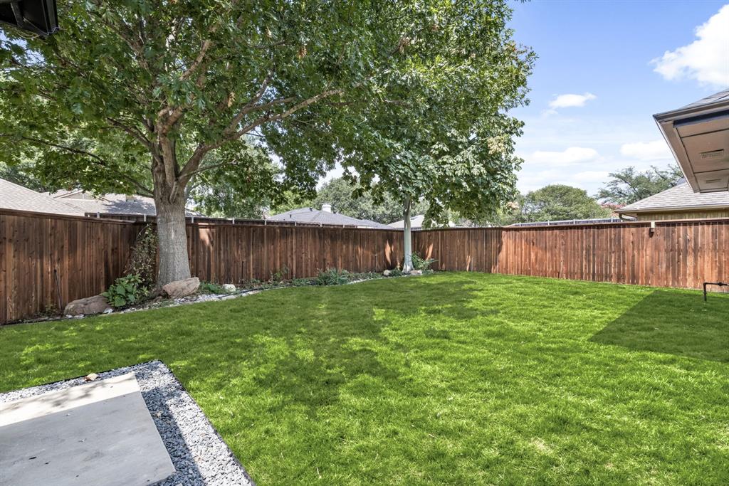 1112 Chesterton Drive Richardson, TX 75080 - Photo 29 of 31 a view of a backyard with wooden fence