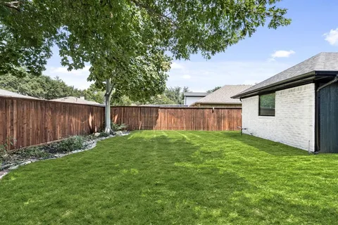 a view of a backyard with a garden