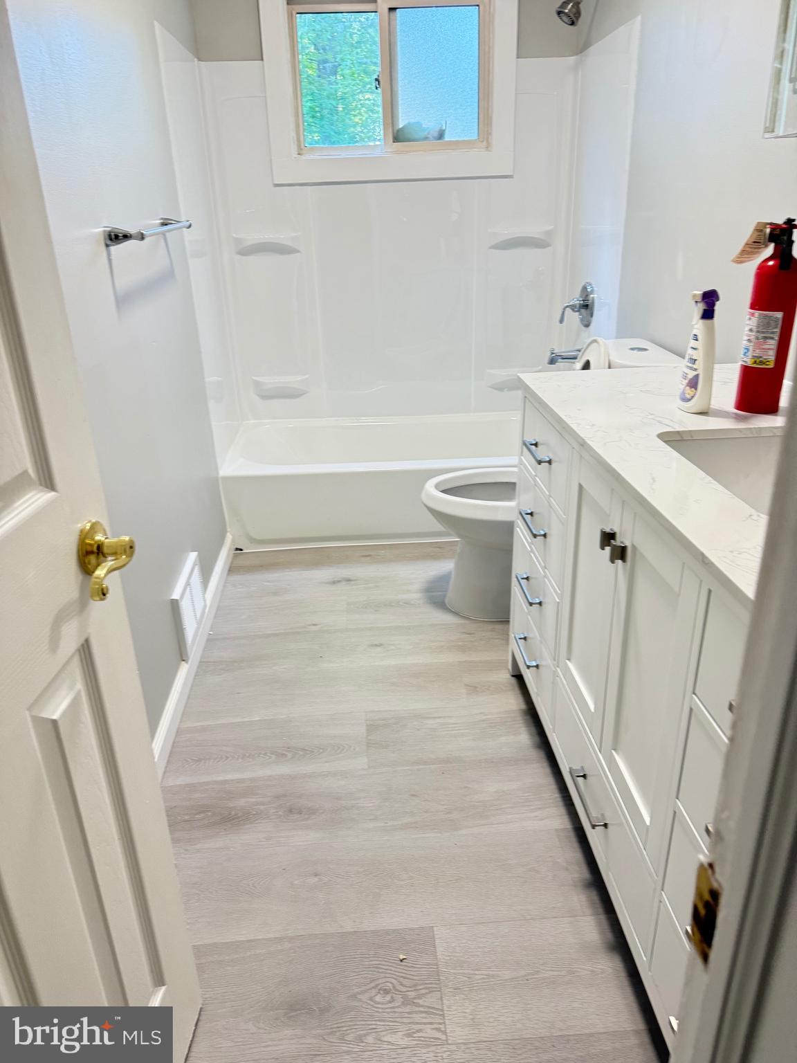 930 Woodlane Road Mount Holly, NJ 08060 - Photo 11 of 26 a bathroom with a sink a toilet and a mirror