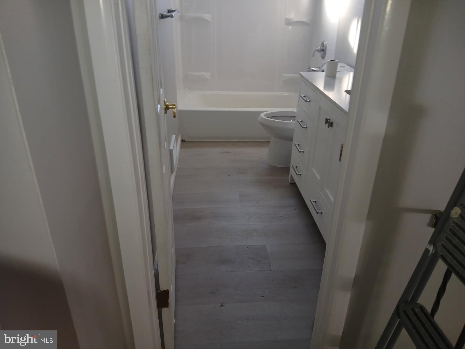 930 Woodlane Road Mount Holly, NJ 08060 - Photo 12 of 26 a bathroom with a sink and toilet