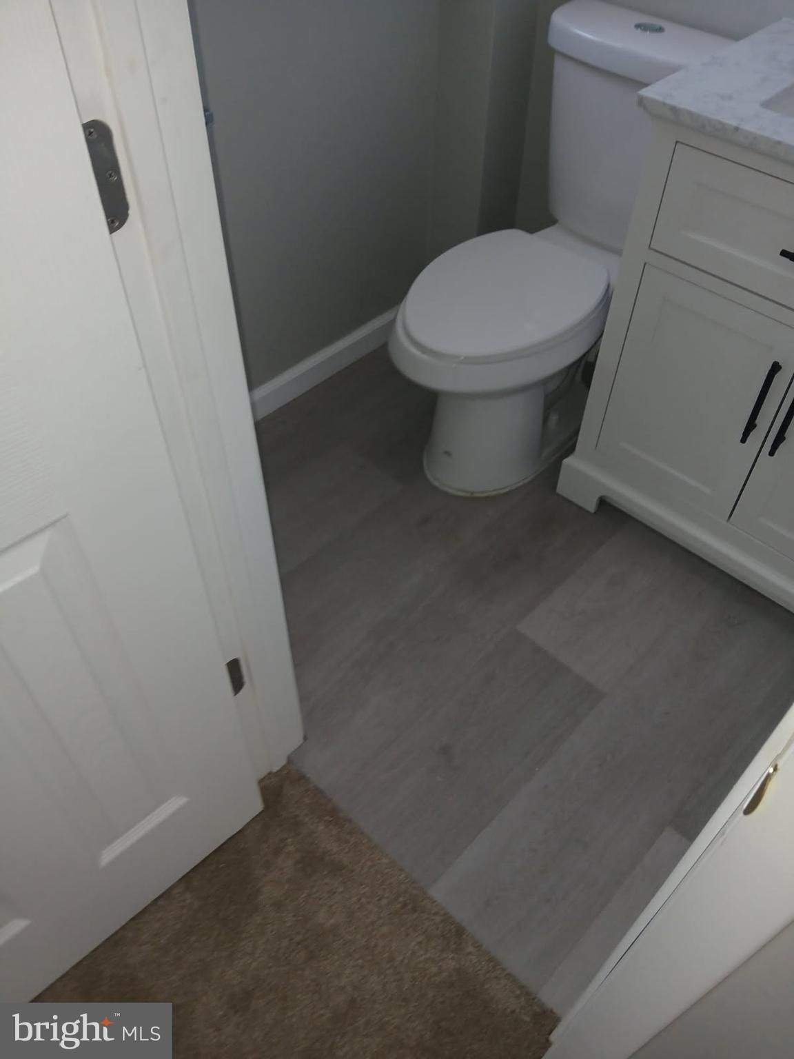 930 Woodlane Road Mount Holly, NJ 08060 - Photo 24 of 26 a white toilet sitting next to a sink